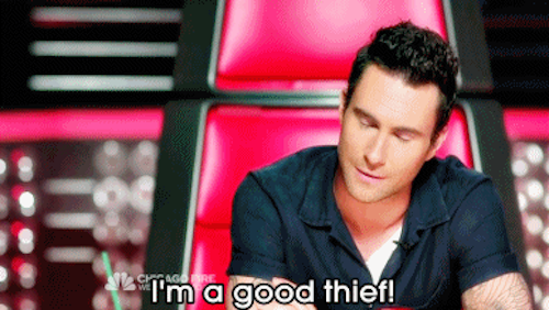 Photo of Adam Levine with his eyes closed sitting in a judge chair on The Voice with text overlay "I'm a good thief!"