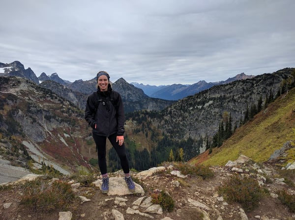 Photo of Allie Hall, Customer Success Engineer at Textio atop a mountain
