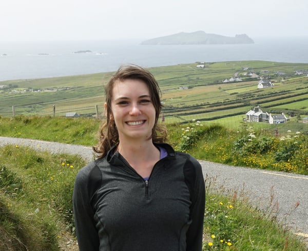 Photo of Textio's Shannon Capper with fields and water in the background
