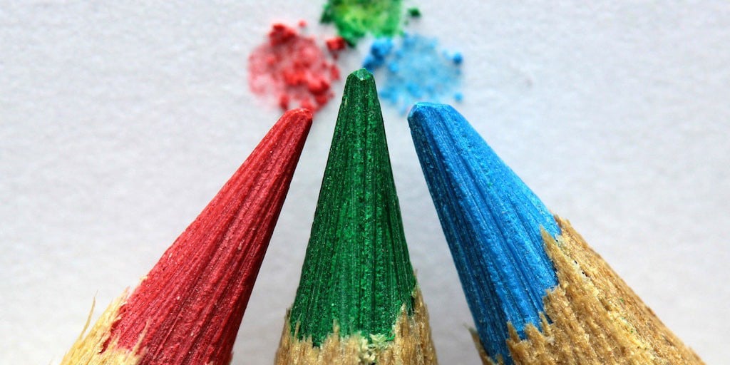 Three colored pencils red green and blue